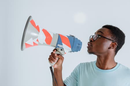 A man speaking into a megaphone.