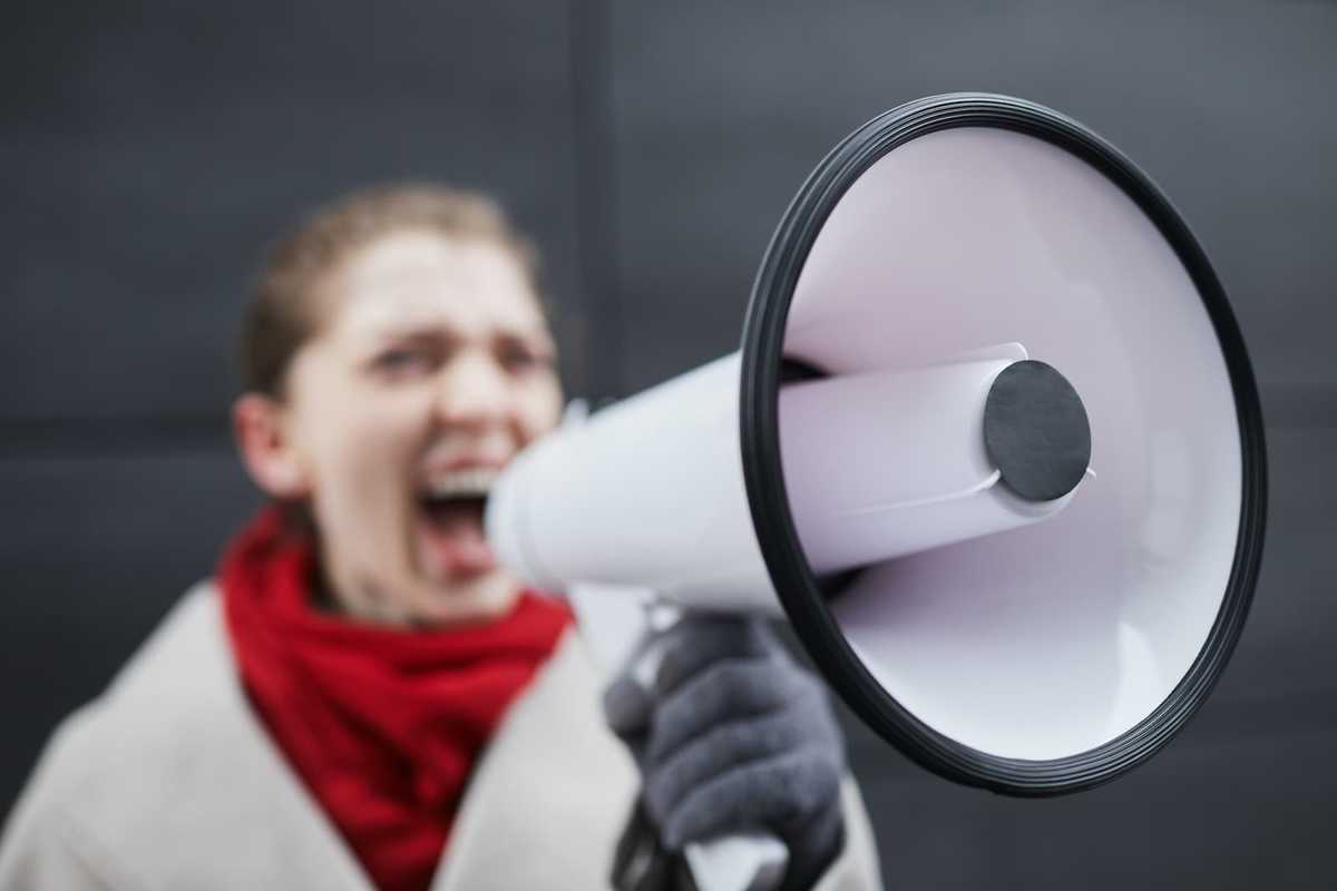 Woman Speaking into a Megaphone