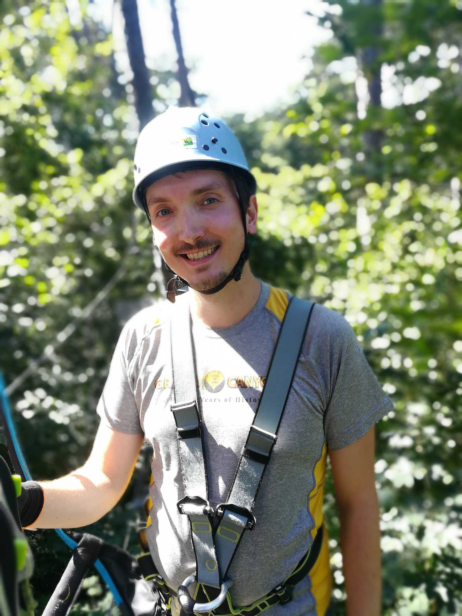 Alexander Lehner in full gear in a treetop rope park
