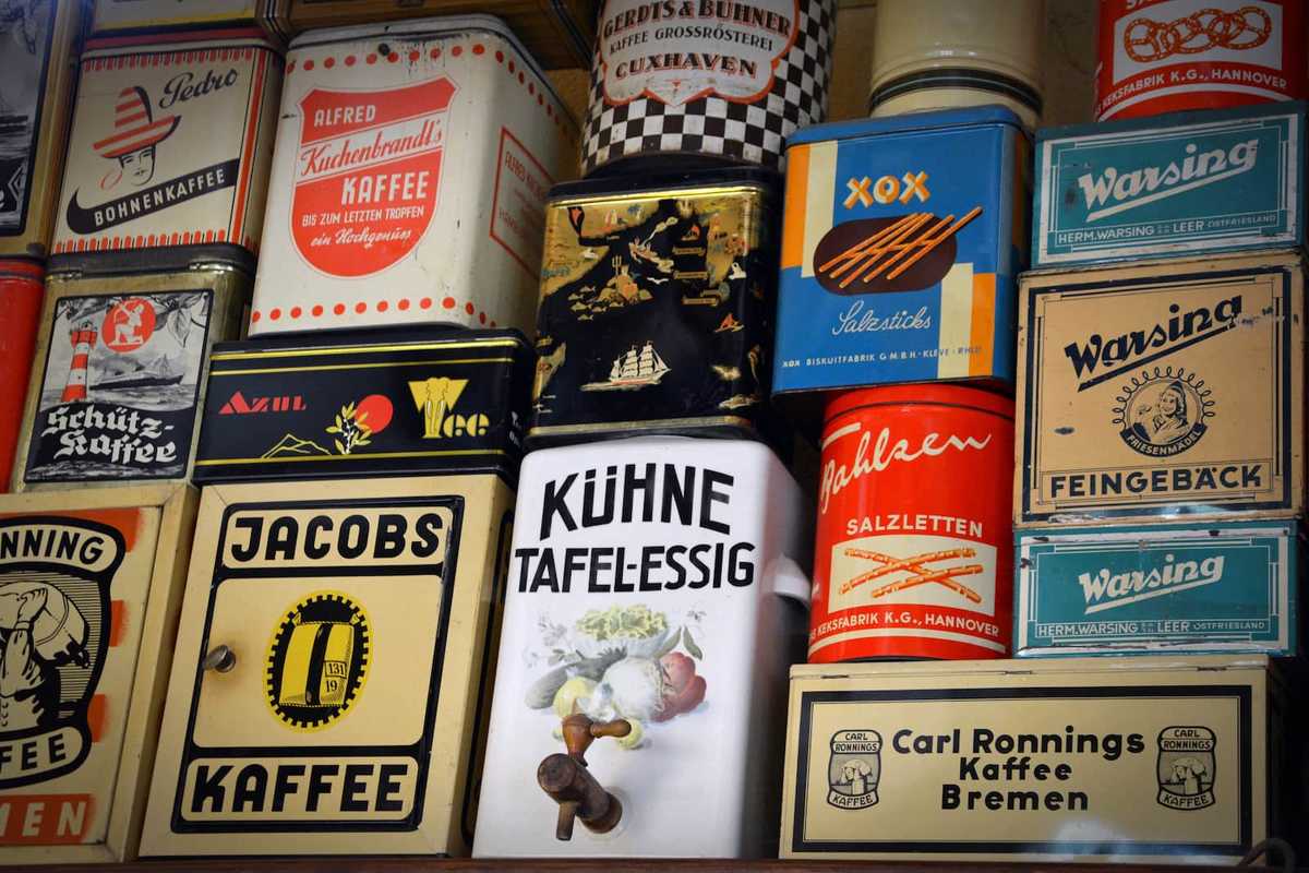 Different size coffee cans stacked on top of each other.